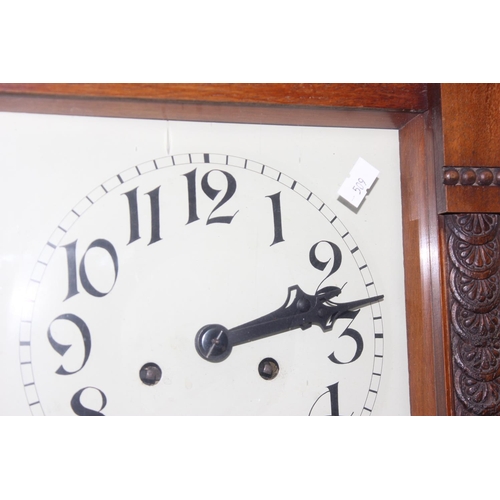 1302 - Art Deco period mechanical wall clock in mahogany case with pendulum and keys