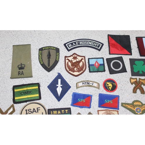 1448 - A large qty of assorted military fabric patches and medal ribbon bars etc, mainly 20th century