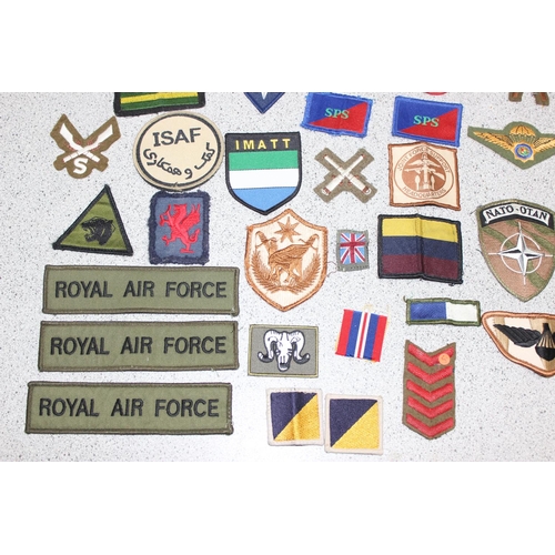 1448 - A large qty of assorted military fabric patches and medal ribbon bars etc, mainly 20th century