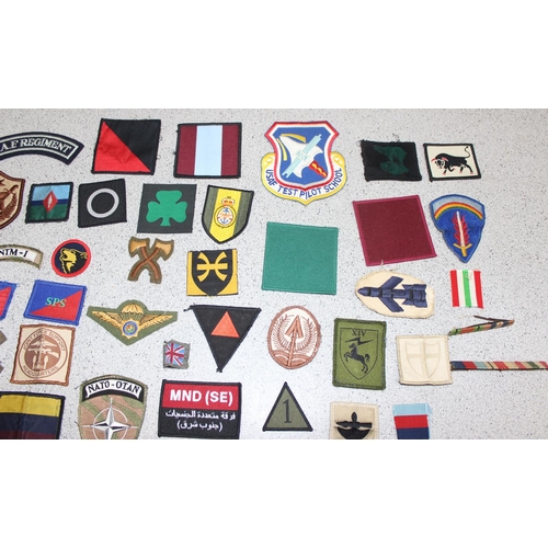 1448 - A large qty of assorted military fabric patches and medal ribbon bars etc, mainly 20th century