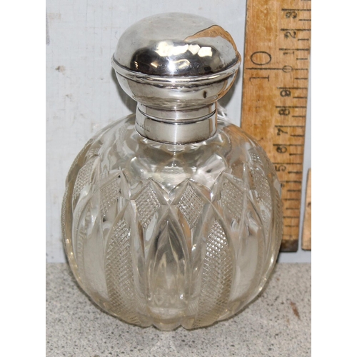 1007 - A silver topped and cut glass grenade shaped perfume bottle, Birmingham 1907 by M & C Lister Limited