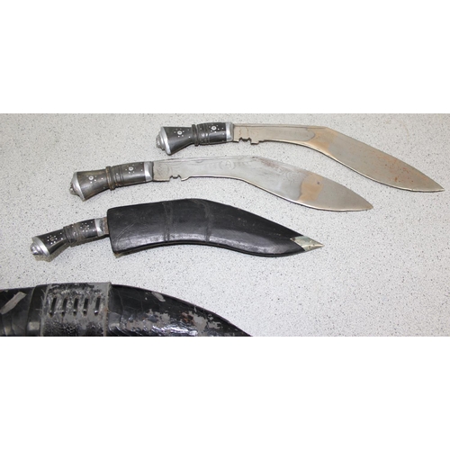 1403 - 5 assorted Kukri knives, 3 with sheaths, one bearing 5th Gurkha Rifles badge, another with blade sta... 