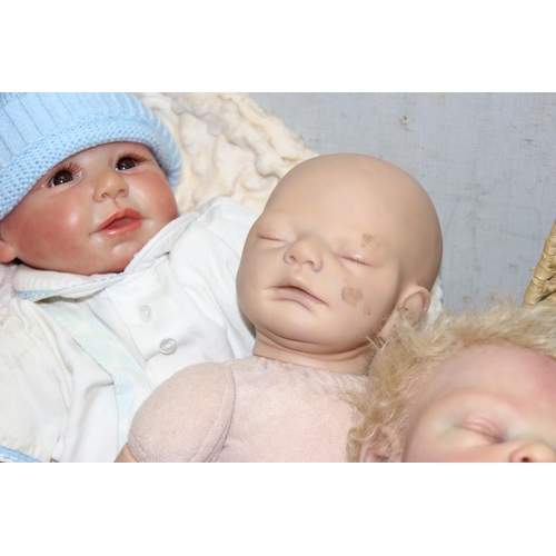 1510 - Qty of reborn style dolls, to incl Bountiful Baby and a wicker bassinet