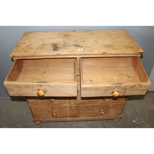 63 - An antique pine 2 over 3 chest of drawers with bun feet and handles, approx 84cm wide x 46cm deep x ... 