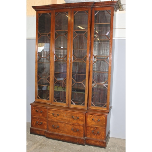 146 - An extremely large 19th century mahogany bookcase, a bank of 6 drawers below 3 large glazed cases, a... 