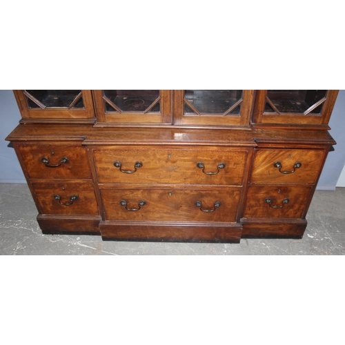 146 - An extremely large 19th century mahogany bookcase, a bank of 6 drawers below 3 large glazed cases, a... 