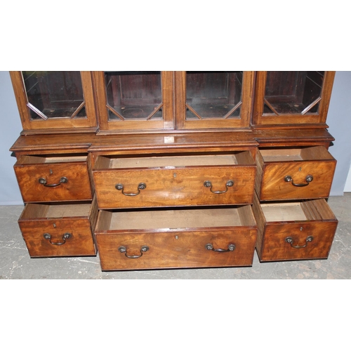 146 - An extremely large 19th century mahogany bookcase, a bank of 6 drawers below 3 large glazed cases, a... 