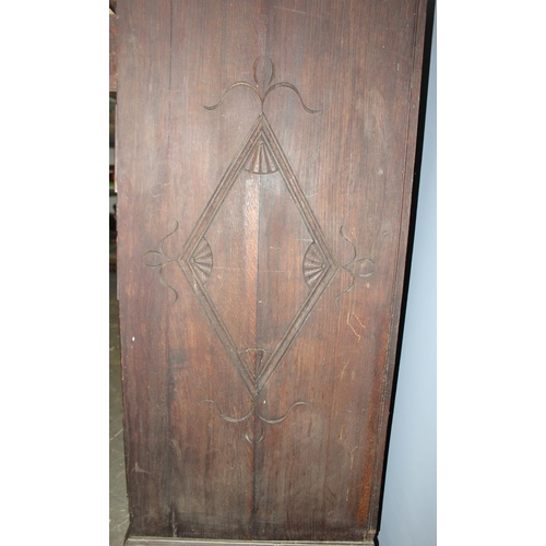 124 - An unusual antique 2 over 5 carved oak chest of drawers with brass fittings, approx 108cm wide x 54c... 