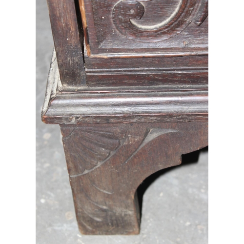 124 - An unusual antique 2 over 5 carved oak chest of drawers with brass fittings, approx 108cm wide x 54c... 