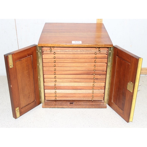 125 - A vintage wooden and brass coin collectors cabinet with 16 internal drawers by Peter Nichols, approx... 