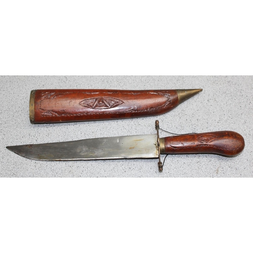 1472 - 2 2 vintage ethnic knives with wooden sheaths, the longest approx 61cm