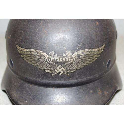 1476 - A WW2 period German Luftschutz (Civil Air Defence) helmet with decal, believed to be an M35 with par... 