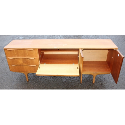 2 - A retro mid-century S-Form teak sideboard by Sutcliffe of Todmorden, 3 drawers to the left, dropdown... 