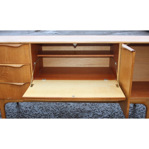 2 - A retro mid-century S-Form teak sideboard by Sutcliffe of Todmorden, 3 drawers to the left, dropdown... 