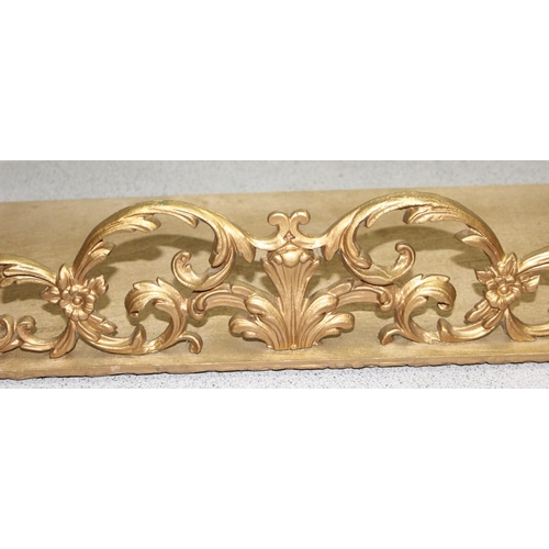 286 - A Rococo style gilt brass and wooden wall hanging shelf, approx 76cm wide