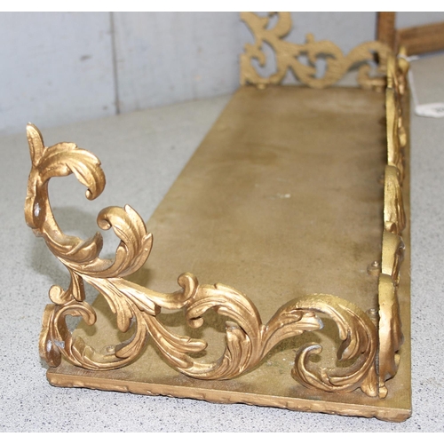 286 - A Rococo style gilt brass and wooden wall hanging shelf, approx 76cm wide