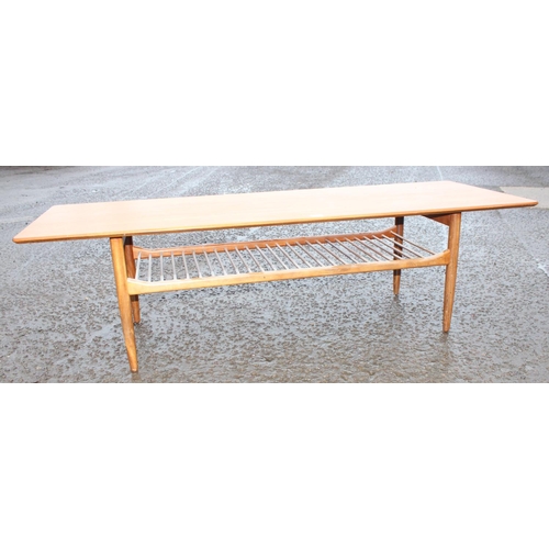 5 - A retro mid-century G-Plan coffee table of large size with magazine rack, approx 159cm wide x 58cm d... 