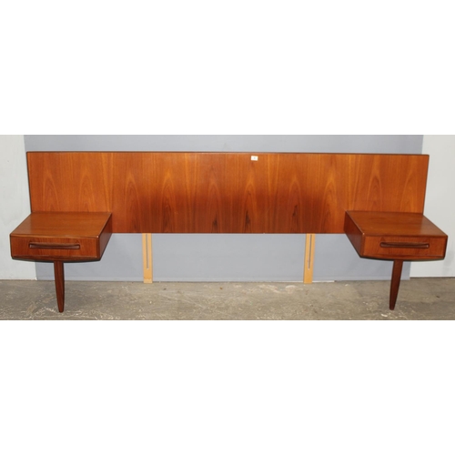 6 - A retro mid-century G-Plan teak upholstered headboard with integral single-drawer bedside tables, ra... 