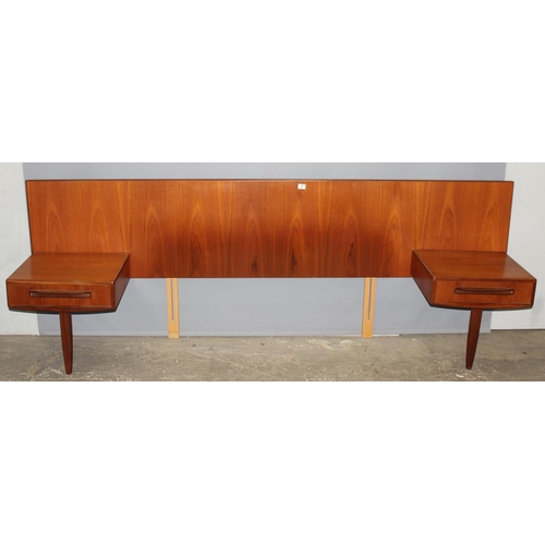 6 - A retro mid-century G-Plan teak upholstered headboard with integral single-drawer bedside tables, ra... 