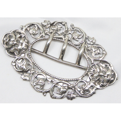 1029 - An antique silver belt buckle with cast Green Man decoration, Chester 1891 by Shepherd & Saunders, a... 