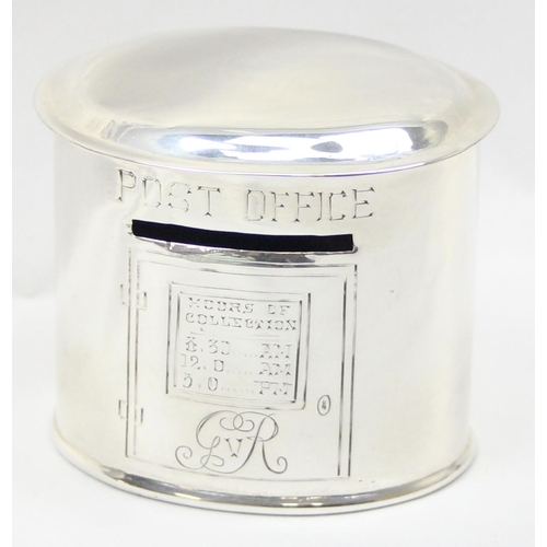 1046 - A rare novelty silver money box formed as an oval pillar postbox, the front engraved with the postin... 