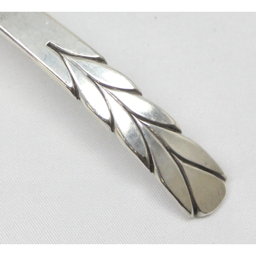 1047 - A modern hand made silver ladle or spoon with chased leaf pattern to the curved handle and hammered ... 