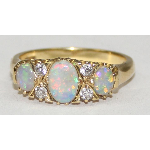 1108 - An 18ct gold trilogy opal and diamond ring, 3 opals are separated by 2 pairs of diamonds, marked and... 