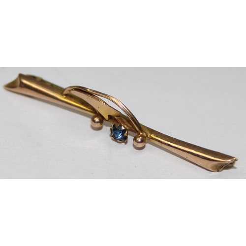 1113 - An early 20th century 9ct gold bar brooch set with sapphire, marked and XRF confirmed, approx 1.08g ... 