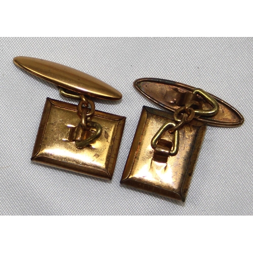 1137 - A pair of early 20th century Essex crystal type gilt metal cufflinks depicting an early motorcar