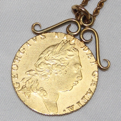 1208 - George III (1760-1820) 1795 Spade Guinea coin, with soldered scrollwork mount and 9ct gold chain, ap... 