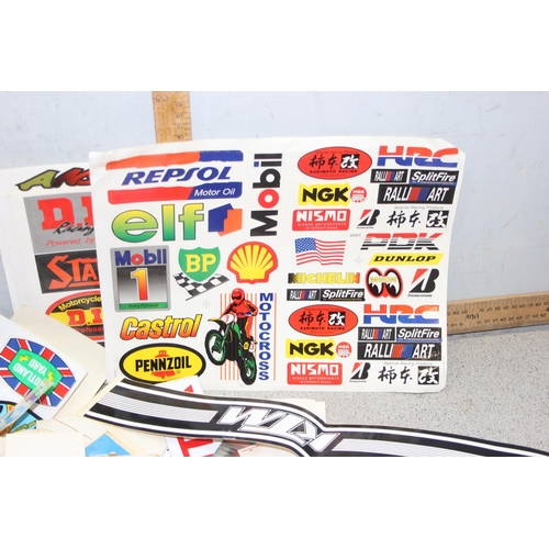 711 - Qty of vintage motoring/racing stickers and other ephemera