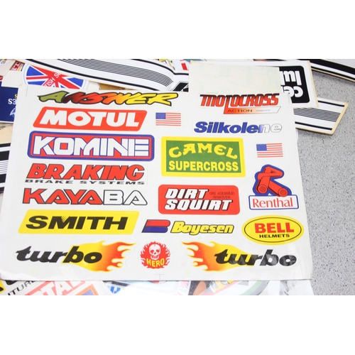 711 - Qty of vintage motoring/racing stickers and other ephemera