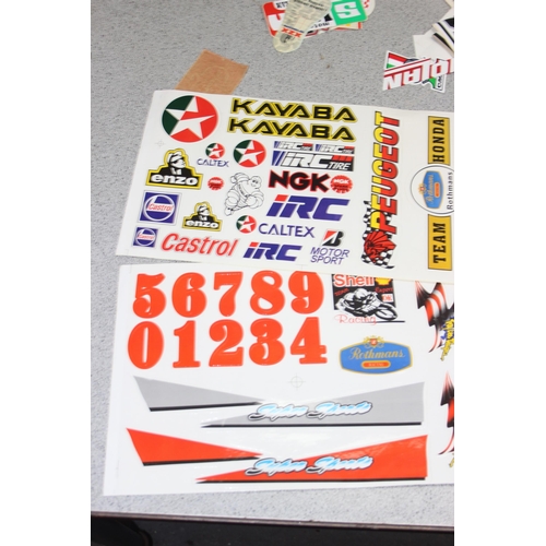 711 - Qty of vintage motoring/racing stickers and other ephemera