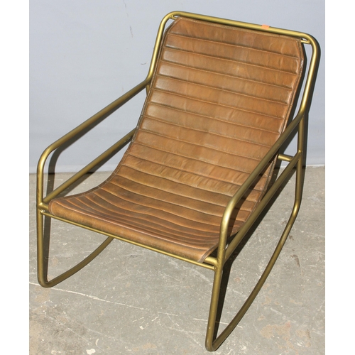 40 - A retro Mutoni style faux leather and metal framed rocking chair, approx 58cm wide x 70cm tall