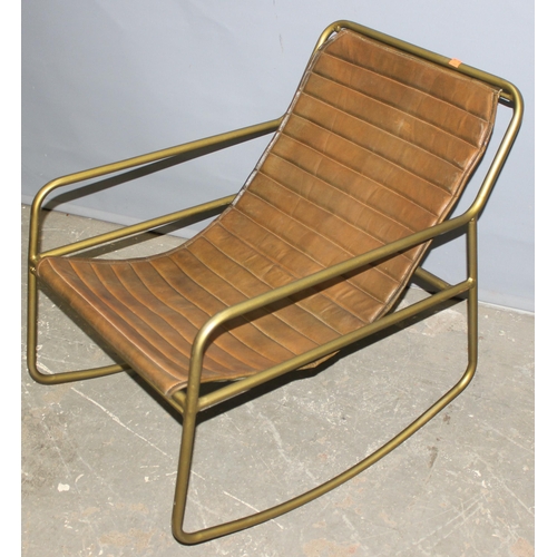 40 - A retro Mutoni style faux leather and metal framed rocking chair, approx 58cm wide x 70cm tall