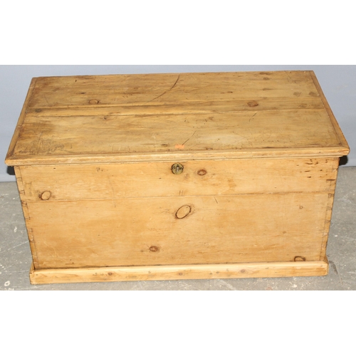 49 - An antique pine trunk with iron handles, approx 90cm wide x 48cm deep x 45cm tall