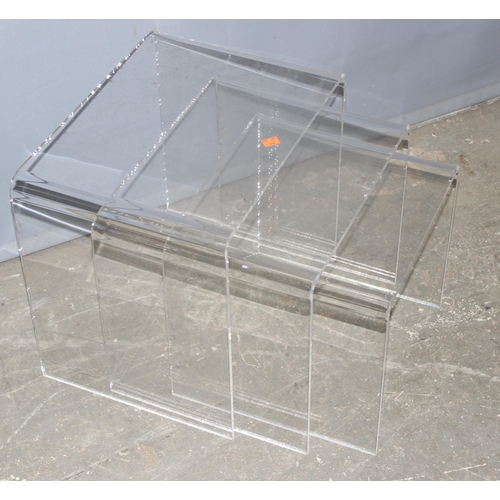 50 - A retro Perspex nest of tables, the largest approx 46cm wide x 33cm deep x 40cm tall