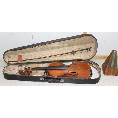 602 - An antique violin in case bearing Joseph Guarneius label to interior, in antique wooden case with un... 