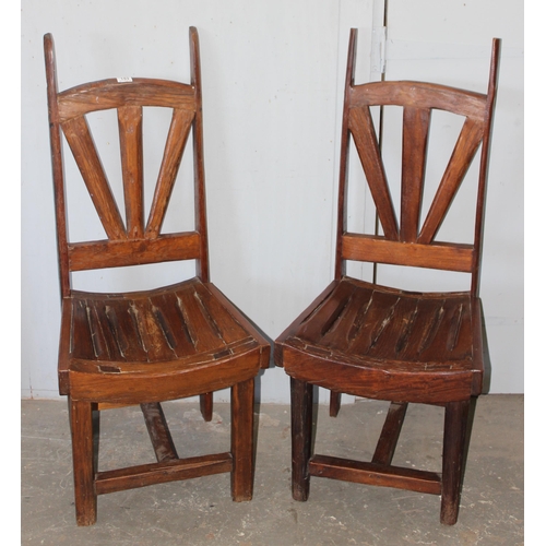 74 - A pair of unusual wooden chairs formed from vintage cartwheels