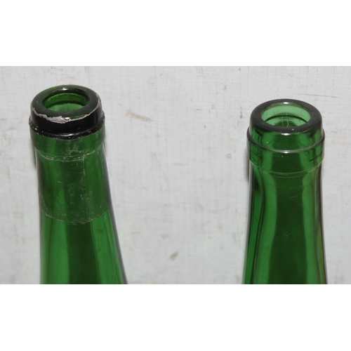 1878 - A pair of vintage embossed and gilt green glass bottles decorated with a clinging monkey, a large re... 