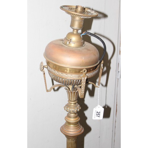 256A - Antique brass standard lamp with onyx dumbwaiter, 3 footed Corinthian style oil lamp later converted... 