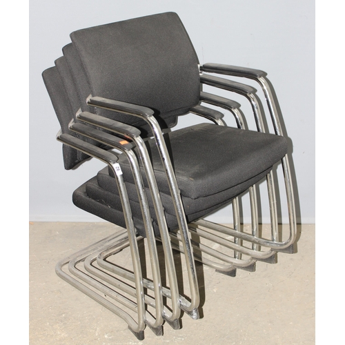 92 - A set of 4 retro style black and chrome stacking cantilever chairs by Komac