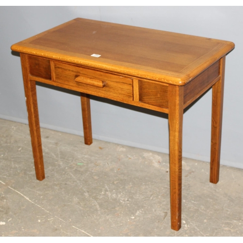 134 - A vintage oak desk or side table with single drawer by Abbess, approx 91cm wide x 53cm deep x 75cm t... 