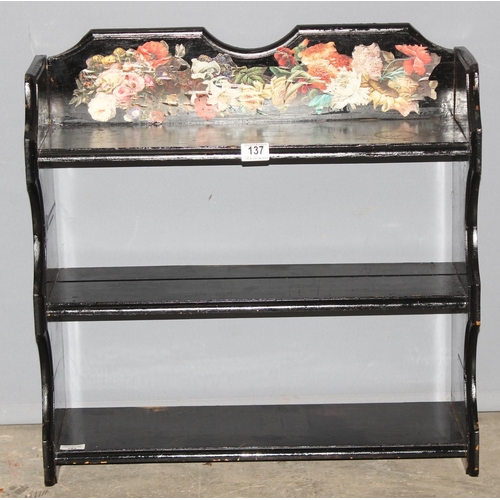 137 - A vintage black painted shelf with decoupage floral decoration, approx 63cm wide x 22cm deep x 63cm ... 