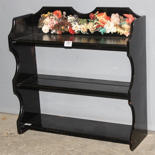 137 - A vintage black painted shelf with decoupage floral decoration, approx 63cm wide x 22cm deep x 63cm ... 