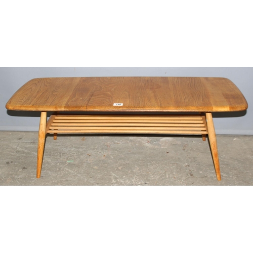 1 - Lucian Ercolani for Ercol Furniture. a retro mid-century blonde finished coffee table with magazine ... 