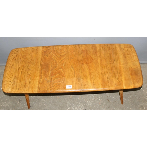 1 - Lucian Ercolani for Ercol Furniture. a retro mid-century blonde finished coffee table with magazine ... 