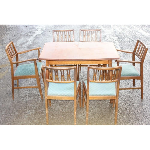 147 - A retro mid-century extending dining table and 6 chairs (4+2), seemingly unmarked, the table approx ... 