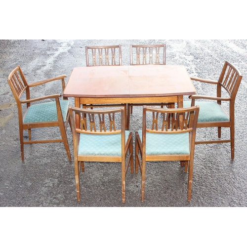 147 - A retro mid-century extending dining table and 6 chairs (4+2), seemingly unmarked, the table approx ... 