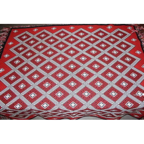 201 - A vintage Welsh style reversible blanket of red, black and white, approx. 215cm x 240cm